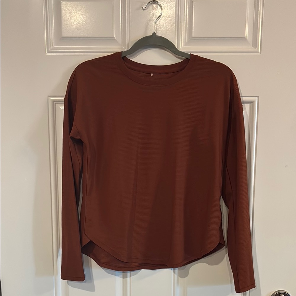 CALIA by Carrie Underwood Long Sleeve Top in rust color. New without tags .